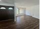 Bright living room with hardwood flooring, new paint, and lots of natural light at 2102 Doefield Ct, Valrico, FL 33596