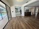 View from the living room into the kitchen and backyard pool area at 2102 Doefield Ct, Valrico, FL 33596
