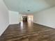 Spacious, open-concept living area features sleek hardwood floors and fresh paint at 2102 Doefield Ct, Valrico, FL 33596