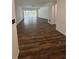 Bright and spacious living room shows hardwood flooring with access to the pool at 2102 Doefield Ct, Valrico, FL 33596