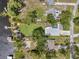 Overhead aerial view of the property highlighting the lake access, pool, and spacious backyard at 21906 Shamu Dr, Land O Lakes, FL 34639