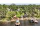 Bird's eye view of the dock, gazebo, picnic area, boat ramp, and the expansive backyard at 21906 Shamu Dr, Land O Lakes, FL 34639