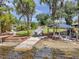 Picturesque backyard featuring a boat ramp, lakeside gazebo, and outdoor entertaining space at 21906 Shamu Dr, Land O Lakes, FL 34639