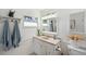 Bright bathroom features updated vanity, lighting, and decorative accents at 21906 Shamu Dr, Land O Lakes, FL 34639