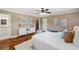 Cozy bedroom featuring neutral decor, a walk-in closet, and an en suite bathroom at 21906 Shamu Dr, Land O Lakes, FL 34639