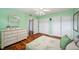 Bedroom showcases hardwood floors and ample space with closet at 21906 Shamu Dr, Land O Lakes, FL 34639