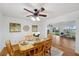 Cozy dining room featuring wood floors and a beautiful view of the water at 21906 Shamu Dr, Land O Lakes, FL 34639