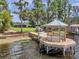 View of the gazebo at the end of the dock, the boat ramp, and the picnic area at 21906 Shamu Dr, Land O Lakes, FL 34639
