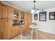 Charming kitchen with wood cabinets, countertop, and island breakfast bar at 21906 Shamu Dr, Land O Lakes, FL 34639