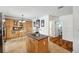 Spacious kitchen with an island, wood cabinets, and eat-in dining area with tile flooring at 21906 Shamu Dr, Land O Lakes, FL 34639