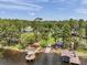 Picturesque lake view showcasing the property's private boat dock and serene waterfront setting at 21906 Shamu Dr, Land O Lakes, FL 34639