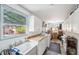 Spacious laundry room featuring ample storage, countertops, and a utility sink at 21906 Shamu Dr, Land O Lakes, FL 34639
