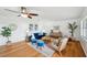 Bright living room features a ceiling fan and decorative furniture, creating an inviting atmosphere at 21906 Shamu Dr, Land O Lakes, FL 34639