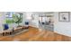 Bright sitting area with wood floors, cozy chairs, and serene outdoor views at 21906 Shamu Dr, Land O Lakes, FL 34639