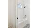 Bathroom featuring shower/tub combo and designer patterned floors at 2604 W Jetton Ave, Tampa, FL 33629