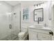 Modern bathroom with a glass enclosed shower, stylish vanity and patterned tile floor at 2604 W Jetton Ave, Tampa, FL 33629