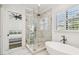 Elegant bathroom with a large walk-in shower, soaking tub, and marble accents at 2604 W Jetton Ave, Tampa, FL 33629