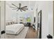 Bright and airy bedroom with a large bed, stylish furnishings, and natural light at 2604 W Jetton Ave, Tampa, FL 33629