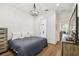Bedroom featuring chandelier, hardwood floors and bright natural light at 2604 W Jetton Ave, Tampa, FL 33629