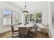 Cozy dining area with a round table, seating for five, and natural light at 2604 W Jetton Ave, Tampa, FL 33629