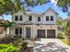 Beautiful two-story traditional home with two-car garage and manicured front lawn at 2604 W Jetton Ave, Tampa, FL 33629