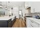 Spacious kitchen with white cabinets, gray backsplash, and stainless steel appliances at 2604 W Jetton Ave, Tampa, FL 33629