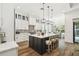 Open concept kitchen with a large island, pendant lighting, and bar stool seating at 2604 W Jetton Ave, Tampa, FL 33629