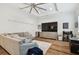 Open concept living room with hardwood floors and recessed lighting at 2604 W Jetton Ave, Tampa, FL 33629