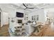 Living room featuring a fireplace, TV, built-in bookshelves, and stylish furniture at 2604 W Jetton Ave, Tampa, FL 33629