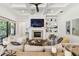 Bright living room with a coffered ceiling, fireplace, built-in shelves and hardwood floors at 2604 W Jetton Ave, Tampa, FL 33629