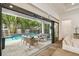Covered patio with sliding glass doors leading to private pool and patio at 2604 W Jetton Ave, Tampa, FL 33629