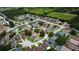 Aerial view of a large residential area with lush green spaces and mature trees interspersed among the homes at 28826 Windover St, Wesley Chapel, FL 33545
