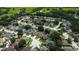 Wide aerial shot showcases a sprawling neighborhood with lush greenery and well-maintained homes at 28826 Windover St, Wesley Chapel, FL 33545