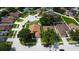 Aerial view of a well-maintained home on a cul-de-sac with mature trees and landscaping in a residential neighborhood at 28826 Windover St, Wesley Chapel, FL 33545