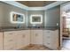 Stylish bathroom features dual sinks, white cabinetry, and modern lighting at 28826 Windover St, Wesley Chapel, FL 33545