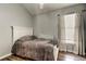 Inviting bedroom with natural light, ceiling fan, and wood-look flooring at 28826 Windover St, Wesley Chapel, FL 33545