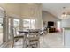 Breakfast nook leading into living area with backyard pool views at 28826 Windover St, Wesley Chapel, FL 33545