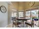 Bright breakfast nook featuring a round table and views of the private pool at 28826 Windover St, Wesley Chapel, FL 33545