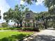 Elegant community entrance sign surrounded by lush landscaping and an American flag at 28826 Windover St, Wesley Chapel, FL 33545