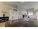 Open-concept dining room features neutral accents and modern furnishings at 28826 Windover St, Wesley Chapel, FL 33545