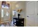 Bright entryway featuring a decorative door, console table, and modern decor accents at 28826 Windover St, Wesley Chapel, FL 33545