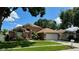 Charming home featuring a two-car garage, nicely landscaped front yard, and inviting curb appeal at 28826 Windover St, Wesley Chapel, FL 33545
