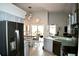 Open concept kitchen with stainless steel appliances, breakfast nook and views to the back yard at 28826 Windover St, Wesley Chapel, FL 33545