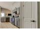 Galley kitchen with neutral cabinets and countertops, stainless appliances, and eat-in kitchen area at 28826 Windover St, Wesley Chapel, FL 33545