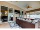 Comfortable lanai provides ample seating, ceiling fans, and access to the living room at 28826 Windover St, Wesley Chapel, FL 33545
