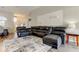 Spacious living room featuring a large sectional sofa and accent wall at 28826 Windover St, Wesley Chapel, FL 33545