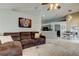 Inviting living room featuring a comfortable sofa, stylish rug, and an adjacent dining area at 28826 Windover St, Wesley Chapel, FL 33545