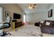 Open-concept living room with lots of light, neutral walls, and flexible layout at 28826 Windover St, Wesley Chapel, FL 33545