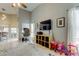 Open-concept living space with high ceilings, neutral tile, and plenty of natural light at 28826 Windover St, Wesley Chapel, FL 33545