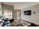 Bright living room showcases accent wall and backyard pool access at 28826 Windover St, Wesley Chapel, FL 33545